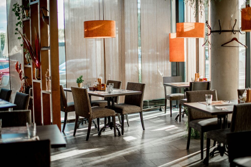 Cozy restaurant interior featuring elegant decor and warm lighting.