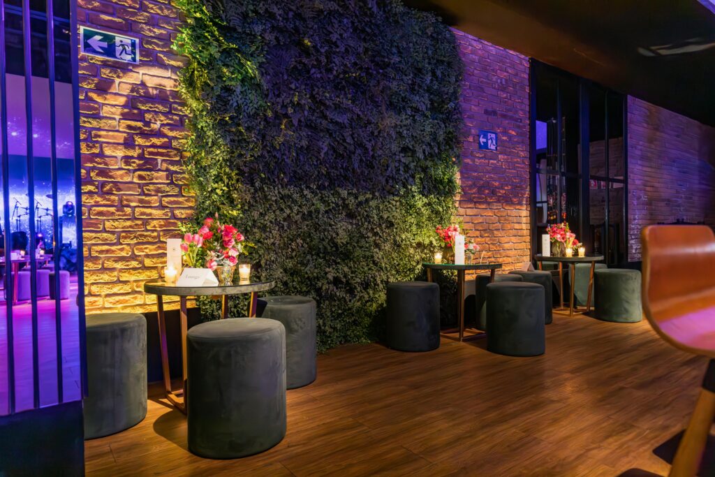 Elegant lounge area with modern decor and ambient lighting, perfect for a chic celebration.