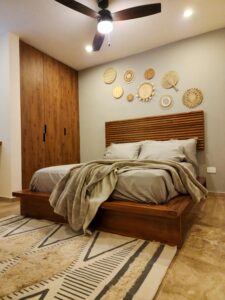 Stylish bedroom interior design with wooden accents and plush bedding for cozy comfort.