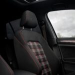 Interior of a modern car with a sunroof and plaid seat design in Totes, Normandie, France.
