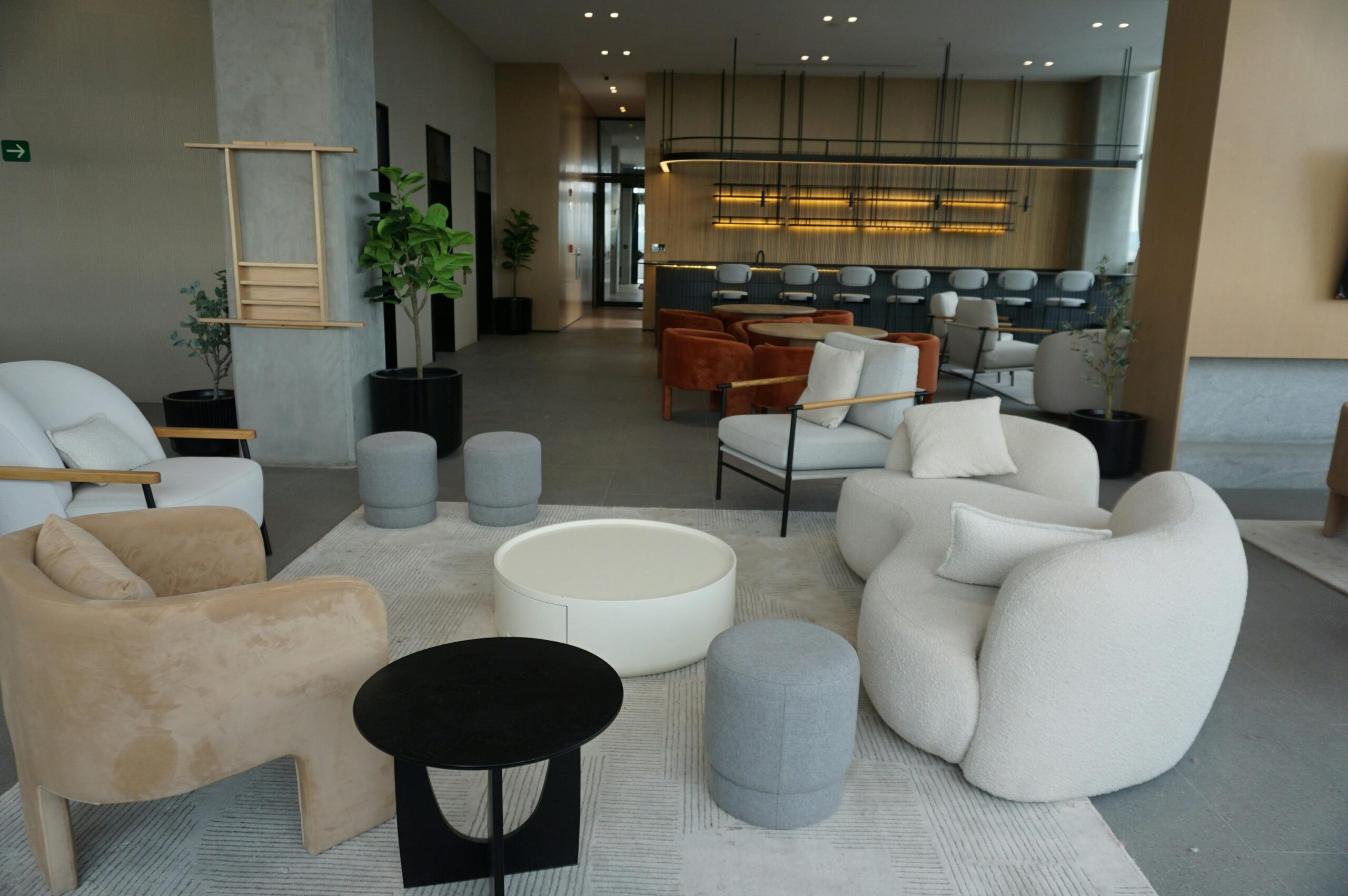 Sophisticated lounge featuring chic modern furniture, ideal for upscale interiors.